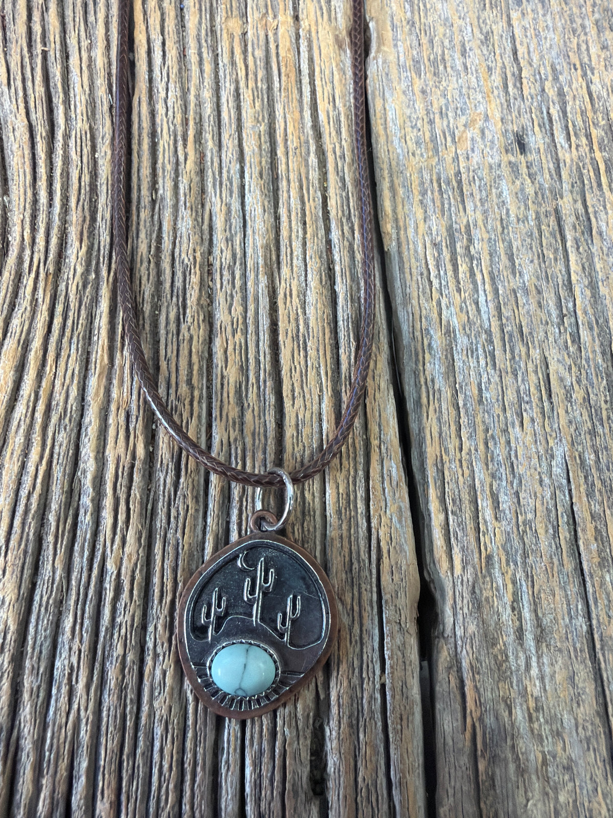 Handmade necklace with a silver cactus with turquoise pendant and handmade leather earrings ￼